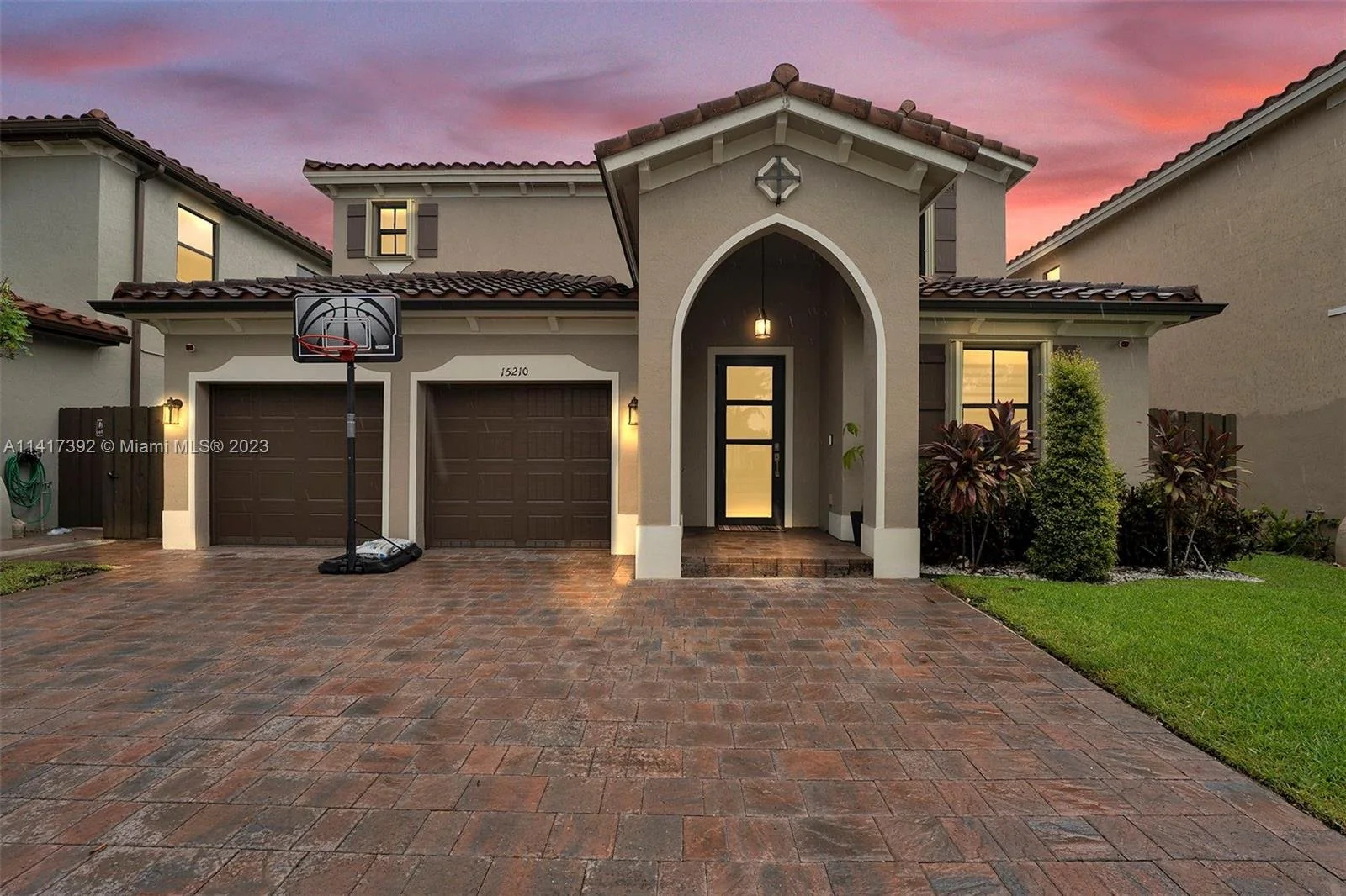 Two-story Richmond West home at dusk